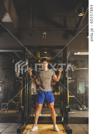 Male and female exercising in gym. Sport, fitness, weightlifting and training concept 440 Male and female exercising in gym. Sport, fitness, weightlifting and training concept 440 60357864
