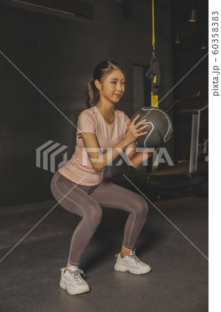 Male and female exercising in gym. Sport, fitness, weightlifting and training concept 230 60358383