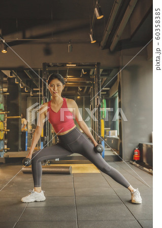 Male and female exercising in gym. Sport, fitness, weightlifting and training concept 162 60358385