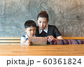 Asian,Woman and little boy sitting, playing tablet 60361824