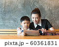 Asian,Woman and little boy sitting, playing tablet 60361831