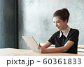 Beautiful asian woman working with tablet. 60361833
