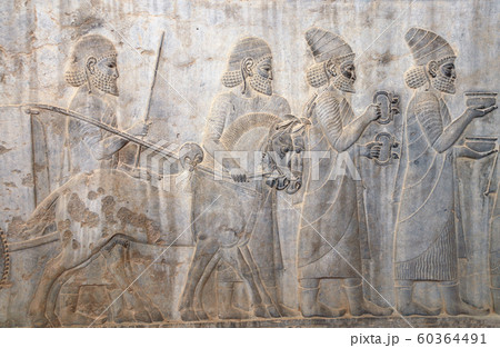 Bas-relief with assyrian warriors and foreign 60364491
