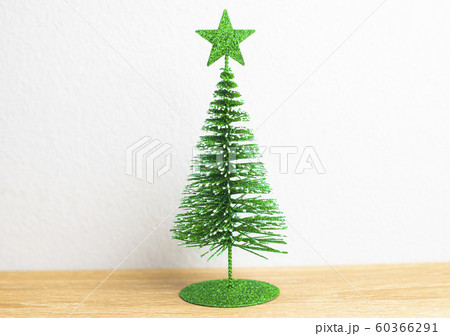 Green star on the top of Green Christmas tree and Green star on the top of Green Christmas tree and 60366291