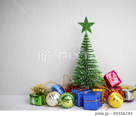 Green Christmas tree with colourful gift boxes and Green Christmas tree with colourful gift boxes and 60366294