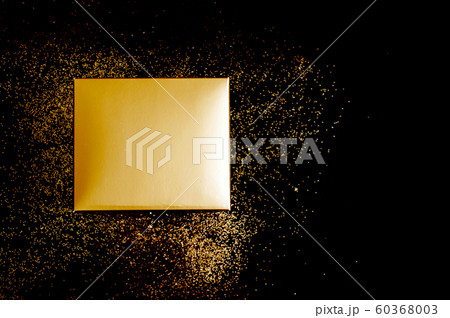 Golden gift box on black background 60368003