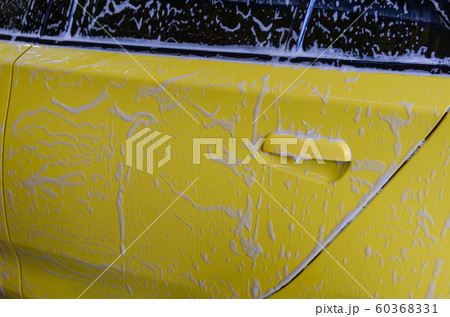 yellow car with foam. 60368331