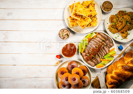 Selection of traditional hanukkah food for festive dinner, wood background 60368509