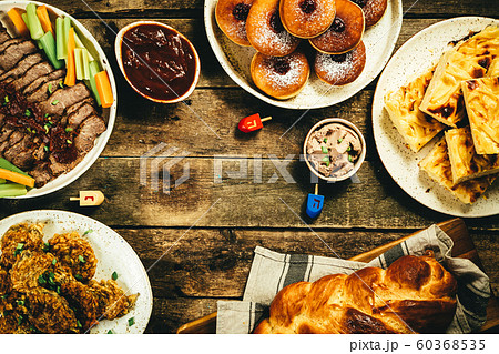 Selection of traditional hanukkah food for festive dinner, wood background 60368535