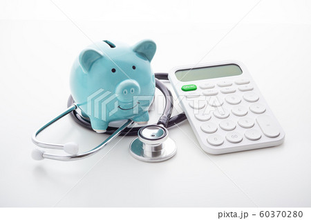 Piggy bank with stethoscope and calculator 60370280
