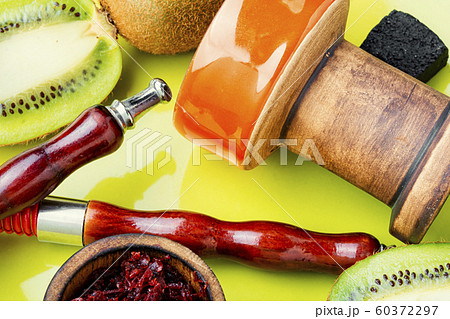 Fragrant smoking hookah with kiwi Fragrant smoking hookah with kiwi 60372297