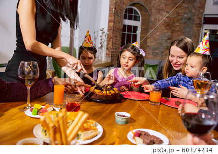Portrait of happy family celebrating a birthday at home 60374234