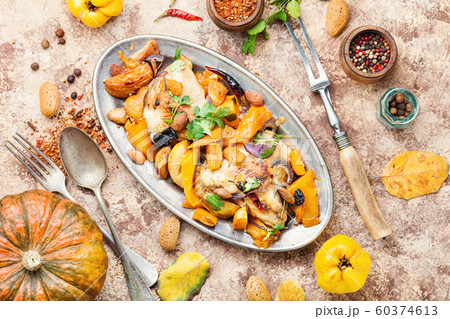 Baked chicken with pumpkin. 60374613