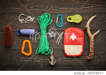 Travel items for hiking over wooden background 60376077
