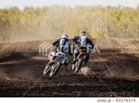 motocross racers on race track 60376374
