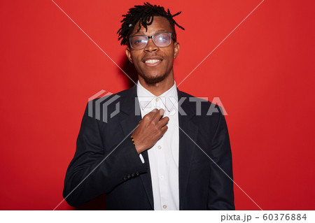 Handsome African Man Posing on Red 60376884
