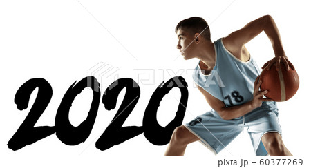 Full length portrait of a young basketball player with ball, meeting 2020 Full length portrait of a young basketball player with ball, meeting 2020 60377269