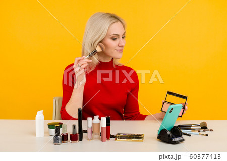 Candid shot of cute young Caucasian woman blogger 60377413