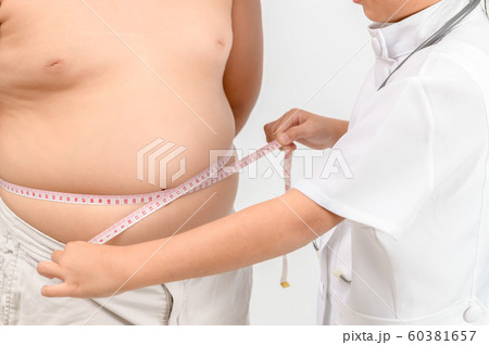 Little doctor measuring obese child waist body fat Little doctor measuring obese child waist body fat 60381657