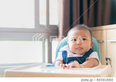 Anorexia, Baby boy sit on feeding chair with Anorexia, Baby boy sit on feeding chair with 60381660