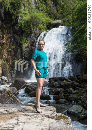 Woman at Korbu Waterfall 60381740