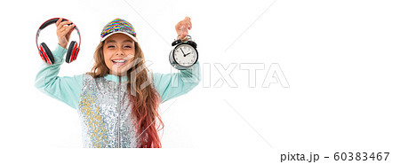 Little pretty caucasian girl in a tracksuit with big earphones and alrm clock, panorama isolated on 60383467