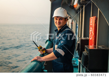 Marine Deck Officer or Chief mate on deck of offshore vessel or ship , wearing PPE personal 60383471