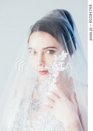 Portrait of a bride in a wedding dress Portrait of a bride in a wedding dress 60384768