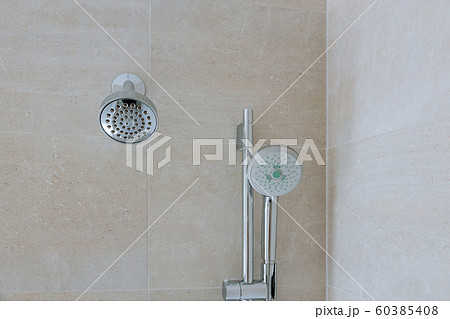 New shower head in the bathroom, close-up wall New shower head in the bathroom, close-up wall 60385408