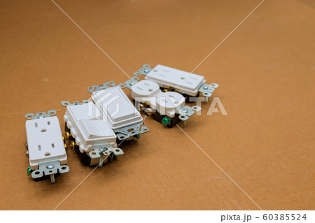Closeup of a US electrical socket and switch 60385524