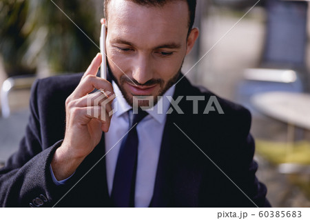 Portrait of handsome male that talking per telephone Portrait of handsome male that talking per telephone 60385683
