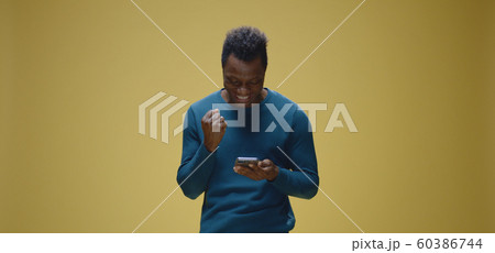 Young man celebrating success 60386744