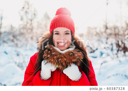 beautiful smiling young woman in winter sunny day outdoor. Winter concept 60387328