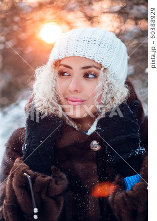 Close-up portrait of beautiful young afro american woman in winter park on sunset 60388929