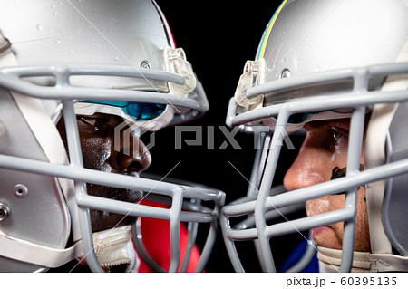 Two American football players head to head Two American football players head to head 60395135