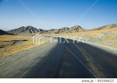 Long empty curve asphalt road in desert with clear blue sky . Long empty curve asphalt road in desert with clear blue sky . 60398625