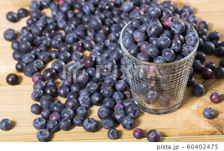 Juicy fresh blueberries on wooden table Juicy fresh blueberries on wooden table 60402475
