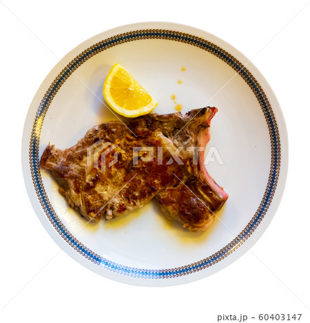 Italian dish - traditional veal chop with lemon 60403147