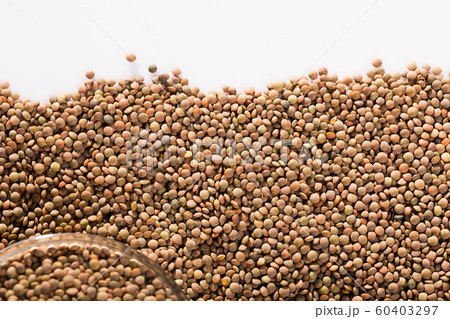 Raw lentils on white background Raw lentils on white background 60403297