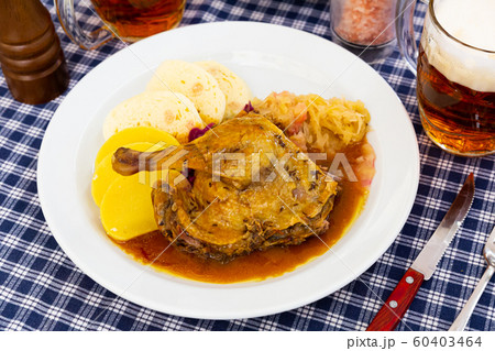 Roasted quarter duck with red and white cabbage, bread and potato dumplings 60403464