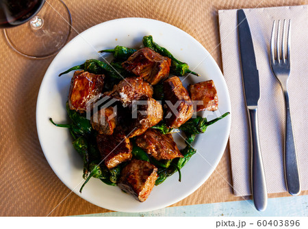 Slices veal of sauce. Tacos de ternera. Spanish dish 60403896