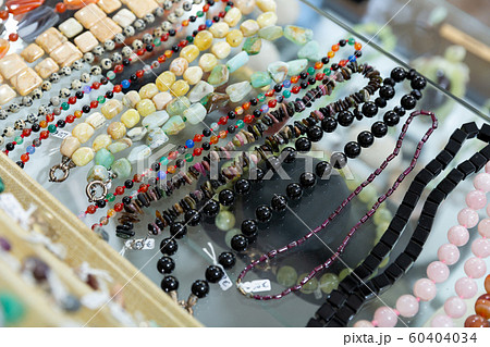 Necklaces from precious stones in jewelry store 60404034