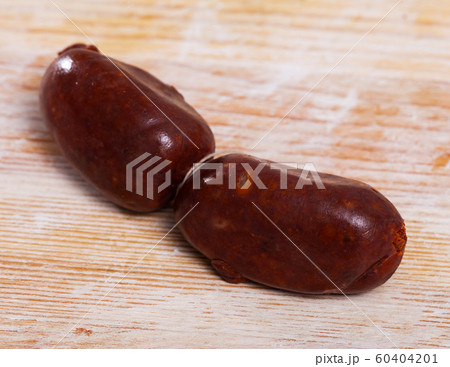 Morcilla on wooden table Morcilla on wooden table 60404201
