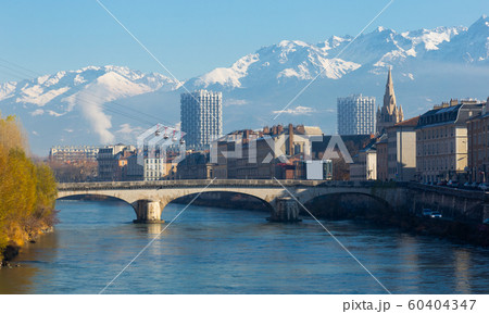 Cable cars over river and bridge in Grenoble in autumn 60404347