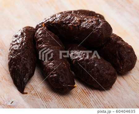 Blood sausages on wooden table Blood sausages on wooden table 60404635