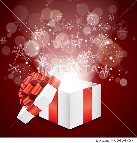クリスマスプレゼントの箱から飛び出す雪の結晶とキラキラのイラスト素材