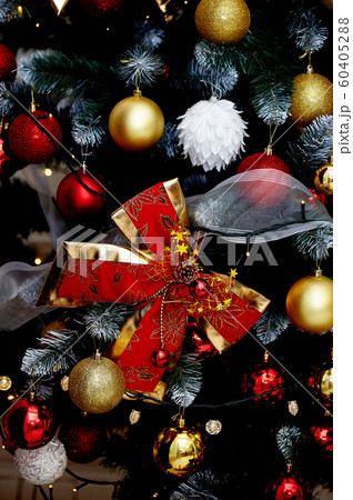 Christmas decoration on the Christmas tree,red bow. The new year 2020. Christmas decoration on the Christmas tree,red bow. The new year 2020. 60405288