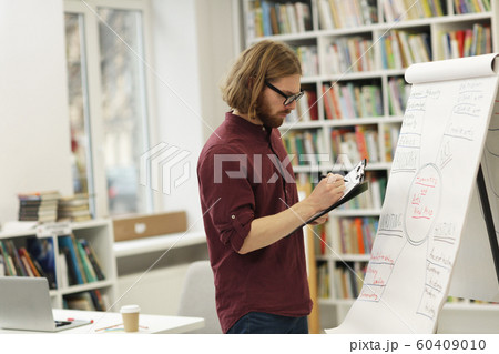 Young teacher preparing for the lecture 60409010