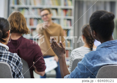 Woman asking question to the speaker Woman asking question to the speaker 60409121