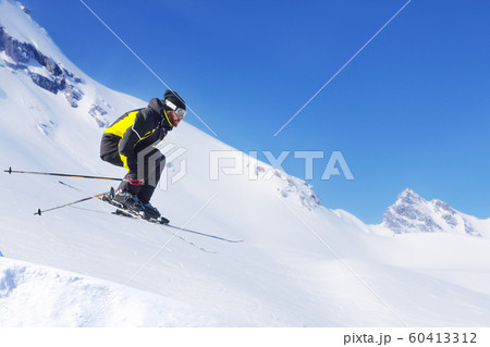 Jumping skier at mountains 60413312